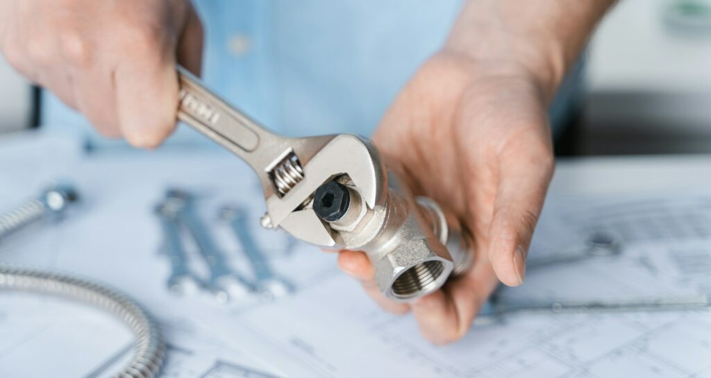 Plumbing project in house.Drawing,diagrams,plan of water supply of apartment,building.Man repairer m